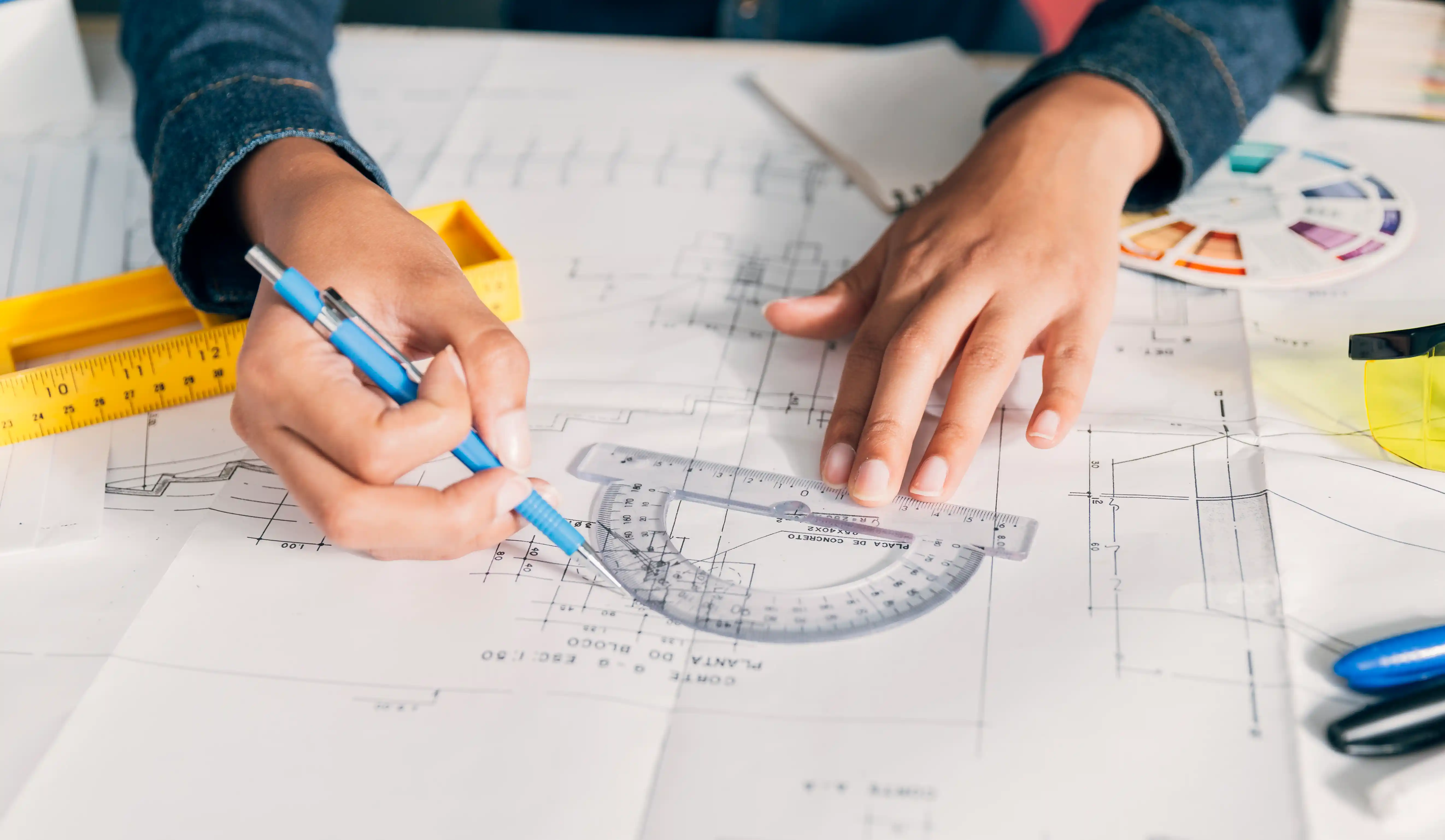 Two workers reviewing project planning on site